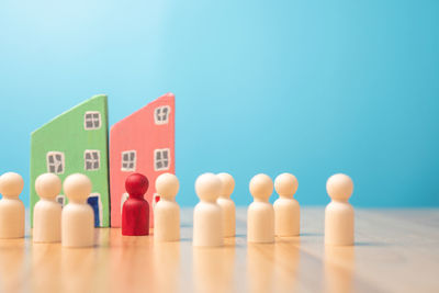 Close-up of toys on table against blue background