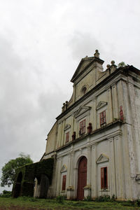 Low angle view of old building against sky