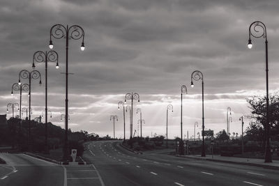 View of street against cloudy sky