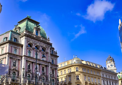 Low angle view of building against blue sky