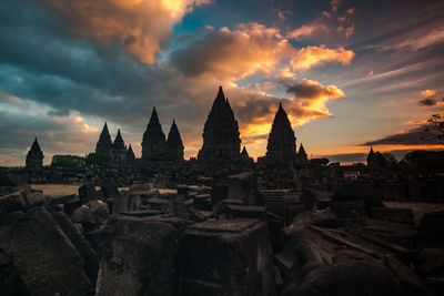 Stupas of building against sky during sunset