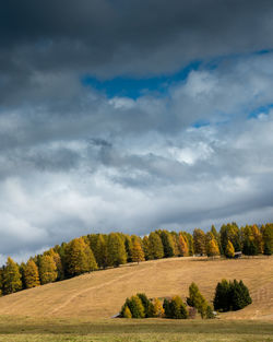 Landscape with beautiful autumn meadow field and the amazing dolomite rocky peaks.
