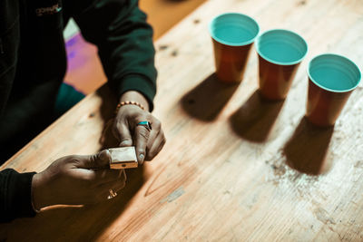 Low section of people on wooden table