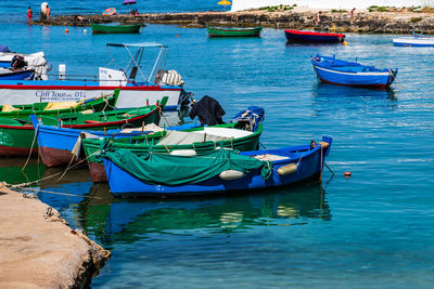 Boats moored in sea