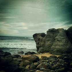 Scenic view of sea against cloudy sky