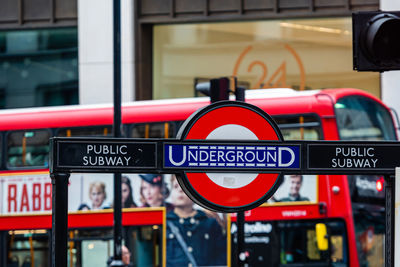 Close-up of information sign on road in city