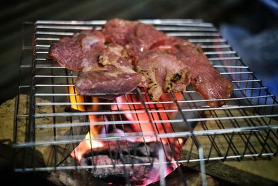 Close-up of meat on barbecue grill