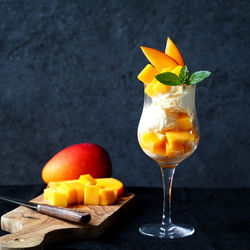 Close-up of orange juice on table