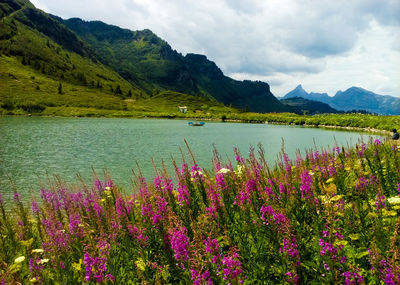 Scenic view of lake against cloudy sky