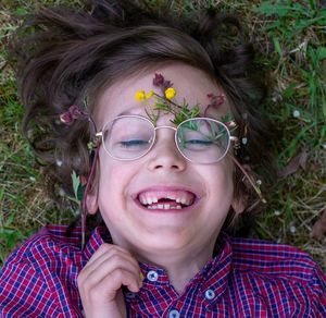 Portrait of smiling boy with flowers