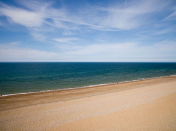 Scenic view of sea against blue sky