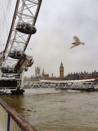 Bridge over river with city in background