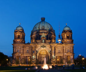 Low angle view of illuminated cathedral against blue sky