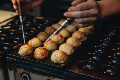 Close-up of man preparing food