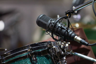 Close-up of microphone over drum at recording studio