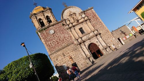 Low angle view of buildings against clear sky