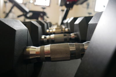 Close-up of dumbbells in gym