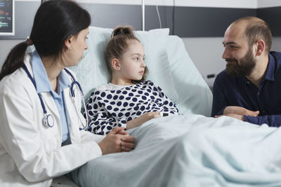 Doctor examining patient at clinic