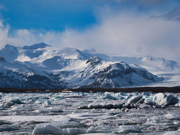 Scenic view of snowcapped mountains against sky