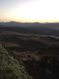 Scenic view of mountains against sky during sunset