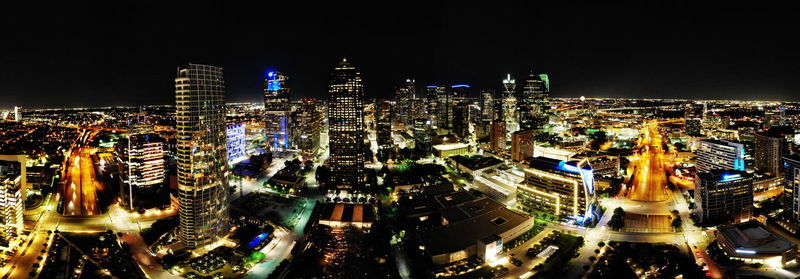 High angle view of illuminated city buildings at night