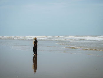 Full length of man walking on beach