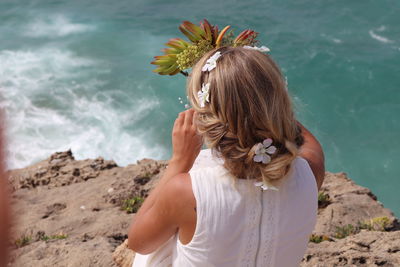 Rear view of woman against sea