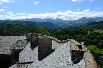 Built structure on mountain against sky