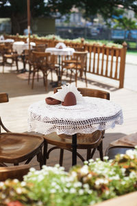 Empty chairs and table at restaurant