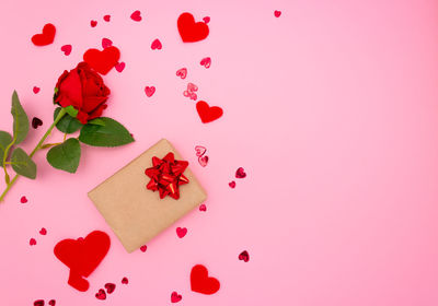 High angle view of pink roses against white background