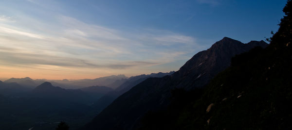 Scenic view of mountains against sky during sunset