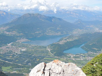 High angle view of lake and mountains against sky