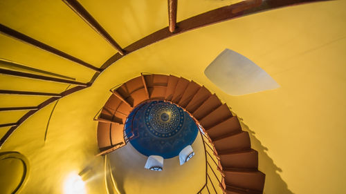 Low angle view of spiral staircase in building