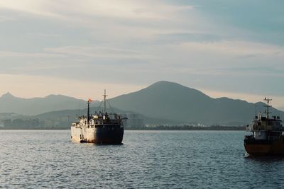 Ship moored on sea against sky