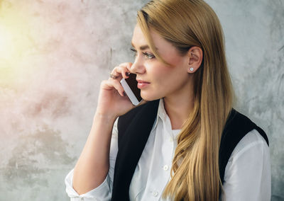 Young woman using mobile phone