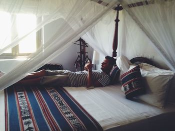 Man relaxing on sofa at home