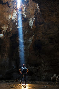 Man standing in cave