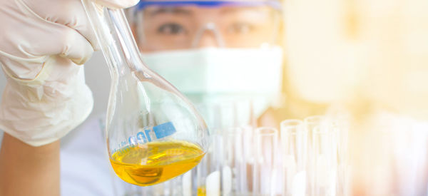 Woman experimenting chemical in lab