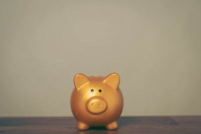 Close-up of piggy bank on table