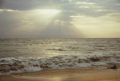 Scenic view of beach against sky during sunset