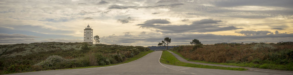 Road amidst plants against sky