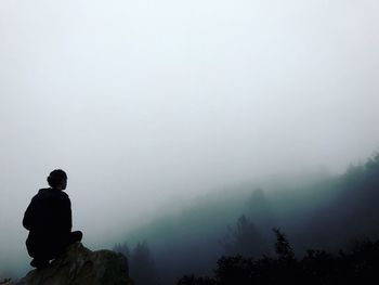 Silhouette of man against sky