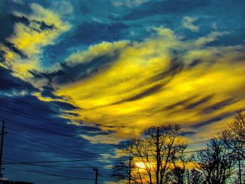 Low angle view of silhouette tree against sky at sunset