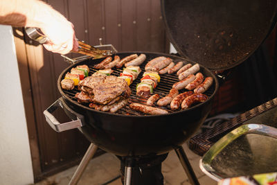 Meat and sausages on grill