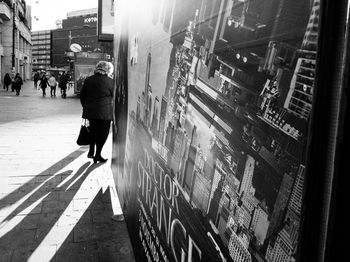 People walking on road in city