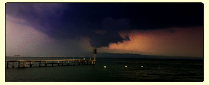 Scenic view of sea against cloudy sky