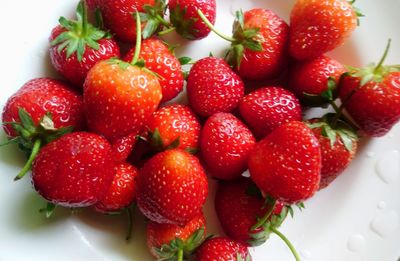 High angle view of strawberries in bowl on table