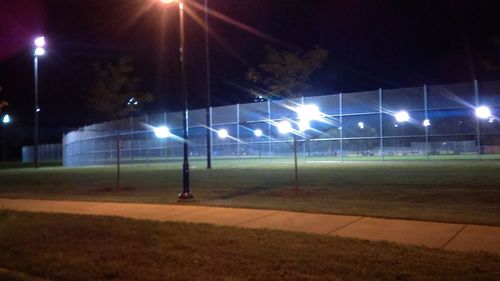 View of illuminated park at night