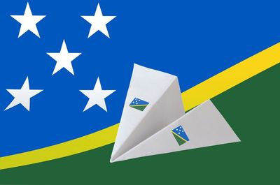 High angle view of flag against blue background