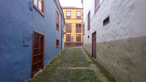 Narrow alley amidst buildings